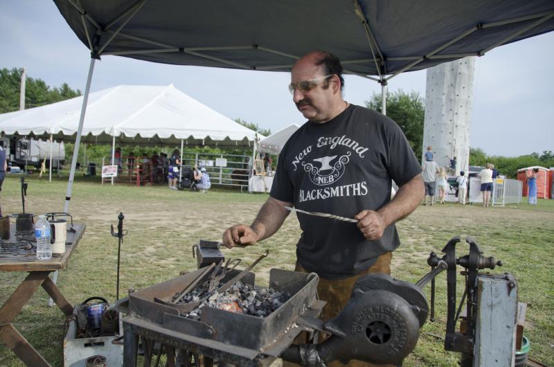 Blacksmith Dean Rantz of Rock Village Forge in Middleboro comes with his forge to the Country Fair every year. BY GEORGIA SPARLING